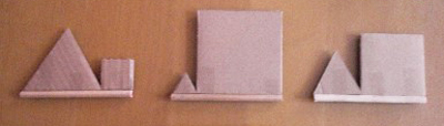  Description : photographie de trois objets dont les triangles et carrés ont des proportions différentes.